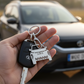 Personalised InGifted car keychain featuring a custom engraved design and sleek metal finish.